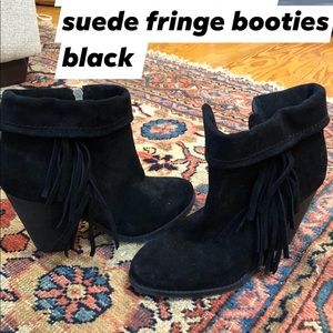 Black fringe ankle booties.